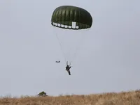 Three RAF Hercules from 2 Group at Lyneham on approach to the Tshikapisk site at Kamestastin for parachute drop of building materials and donated items. Image