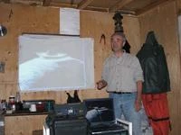 Professor Derek Wilton of Memorial University's Geology department lectures Tshikapisk students and guests on the Kamestastin Impact Crater - September 2005. Photo: Wayne Broomfield, Altius Image